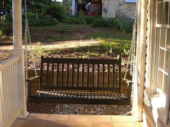 Front porch with ceramic tile and swing
