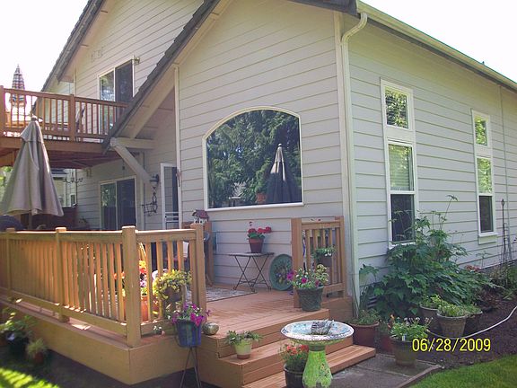 Rear of townhome w/ view to golf course