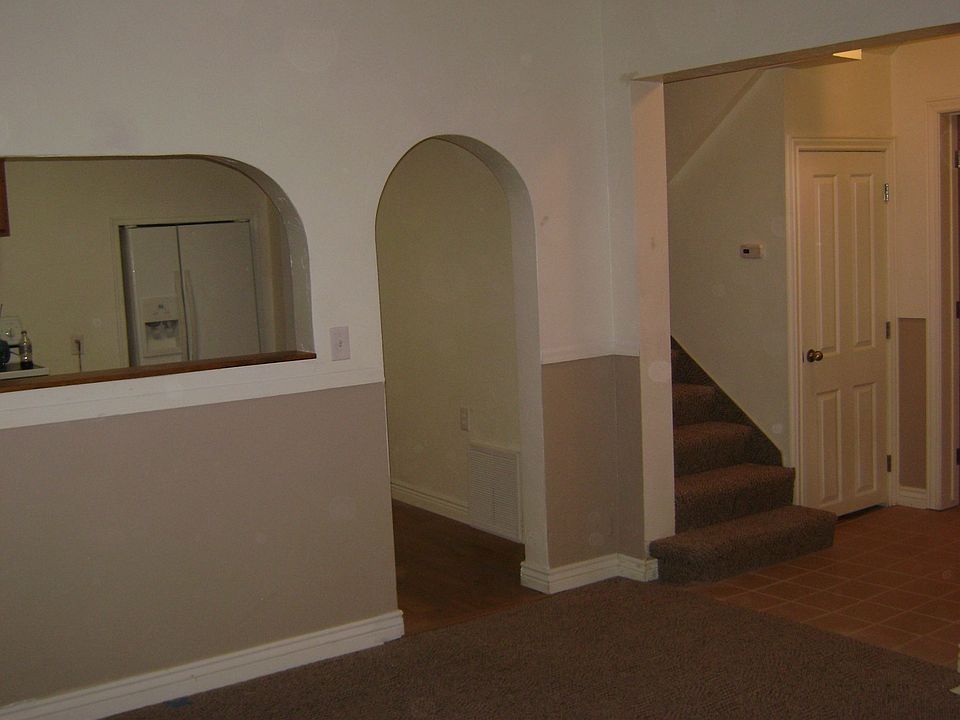 front room looking in to kitchen and entry area 