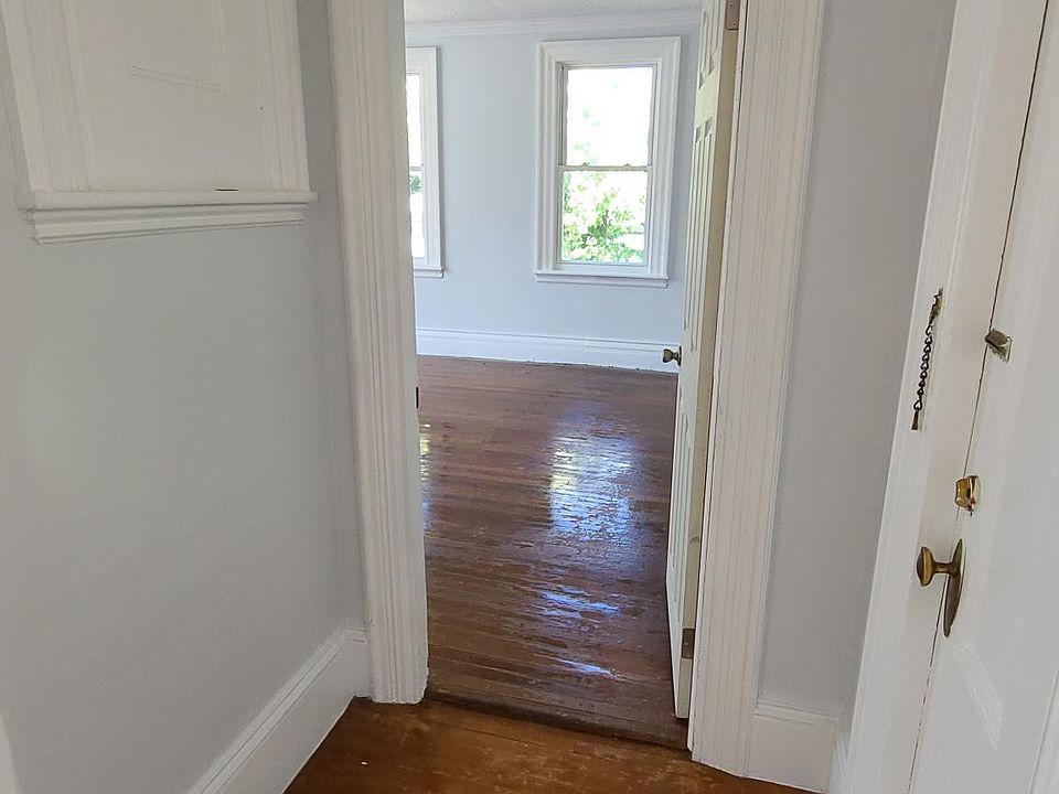 Living room looking into large bedroom