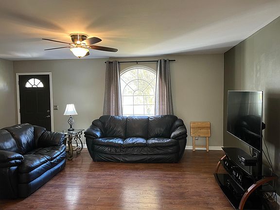 Bright living room with large window providing lots of natural light.