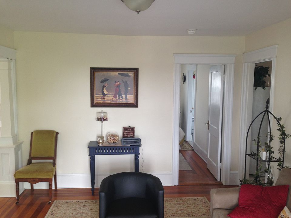 Living room looking away from balcony. Straight ahead is bedroom, to the right is kitchen, to left is bonus room.