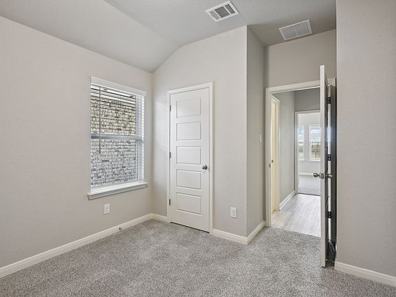 Guest bedroom in the Callaghan floorplan at a Meritage Homes community.