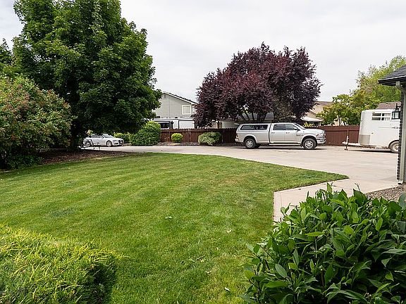 Side yard with huge driveway