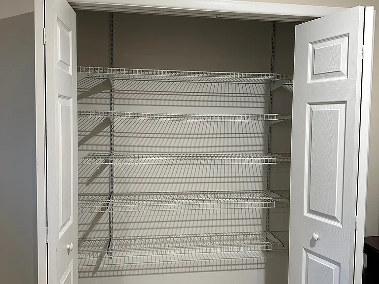 Customer built in shelves offer extras storage space in basement closets.