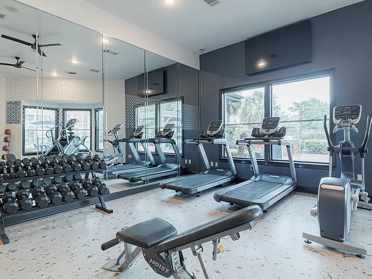 Our fitness center is equipped with a variety of machines: elliptical, treadmill, stairstepper, squat machine, cable and resistance machines, yoga balls, bike, and free weights