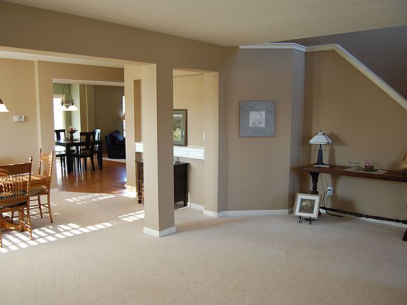 The living room and separate dining area have nice architectural features. 