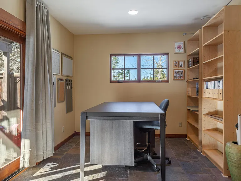 A second workstation provides a large lay out or project table, ample light and high speed internet