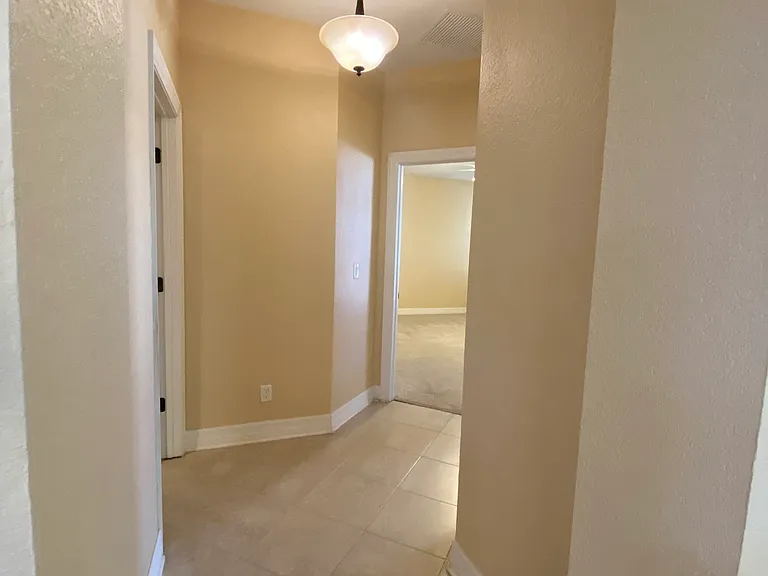 Hallway to Den/Guest Bath/Primary Bedroom