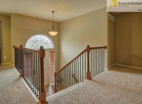 Split tile entry with wrought iron spindles.