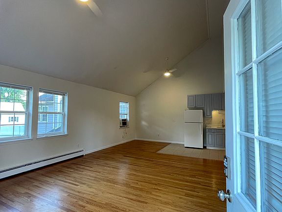 As you enter the home, note the cathedral ceilings, real oak floors, new electronic lock and two remote-controlled ceiling fans with lights.