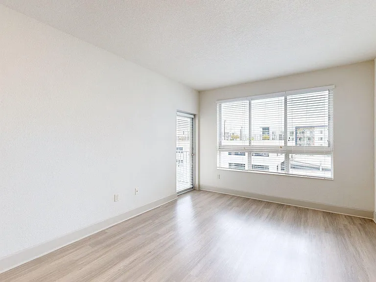 Apartment living room with wood style floor.