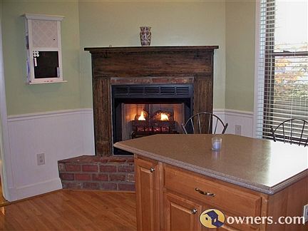 Kitchen with vent-less fireplace