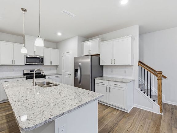 Meadowlark 28 - Kitchen has Seating allowing Cook to Connect with Family
