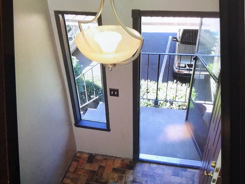 Tile enter and carport across from the townhome 