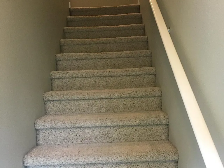 Stairs to kitchen and living room from Entrance