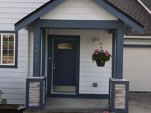 Entrance with stone-trimmed columns.