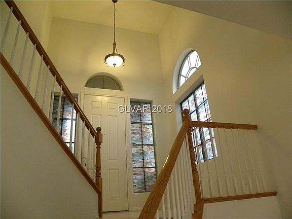 Entry foyer...stairs to upstairs kitchen, great room, master & secondary bed & bath...stairs to downstairs open den & 2 bedrooms