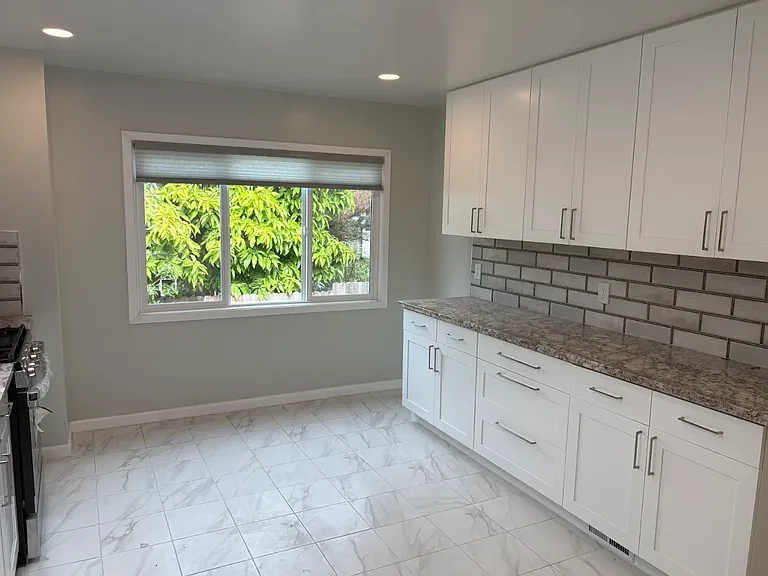 Plenty of lower and upper cabinets and countertop space