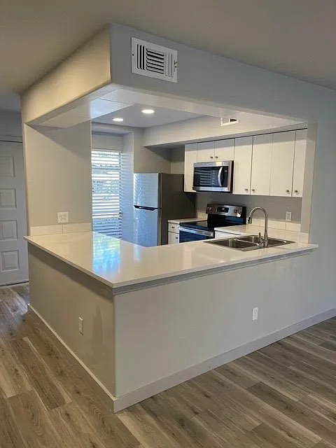 Kitchen view from living room. - 4555 N Oconnor Rd #1278