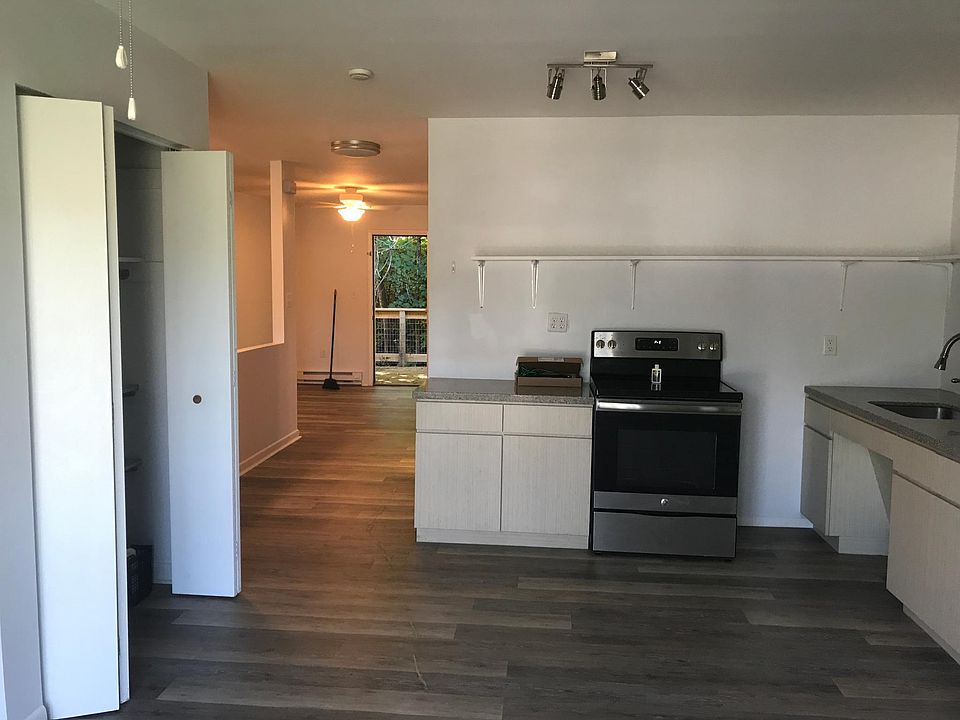 Task lighting in kitchen along with ceiling fan.