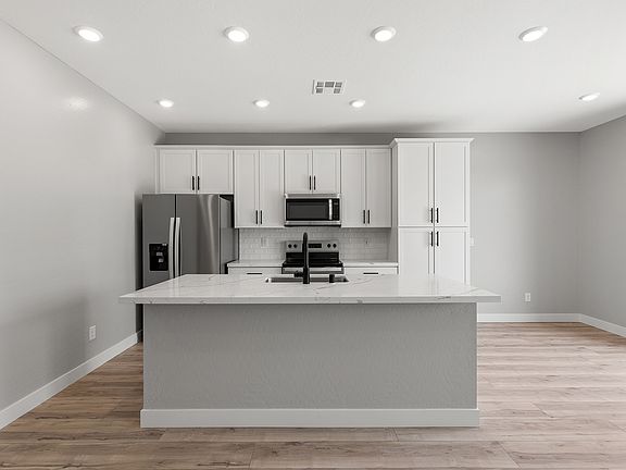 This spacious kitchen island is the perfect area to prepare your favorite meals.