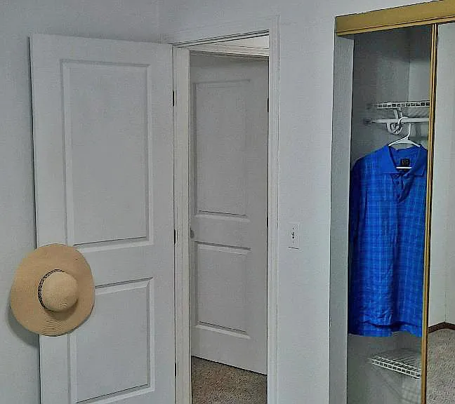 ...the smaller bedroom closet has mirrored, sliding doors....