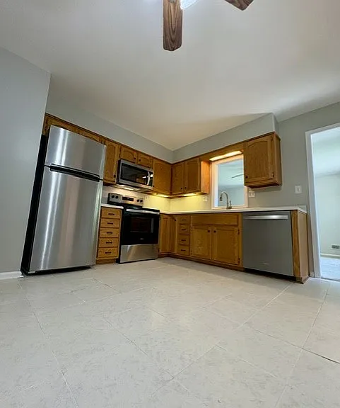 Updated kitchen feature brand new Whirlpool stainless steel appliances and ceramic tile floor.