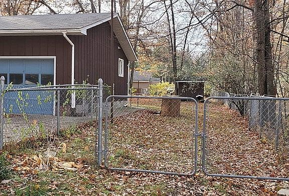 Side entrance to fenced yard