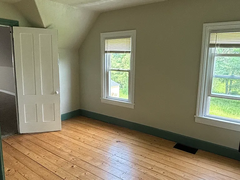 Suite entrance with closet before main bedroom