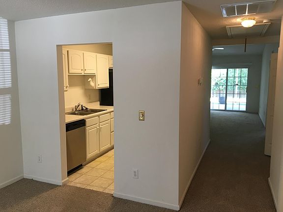 View from the foyer.  Dining area to the left.  Coat closet,