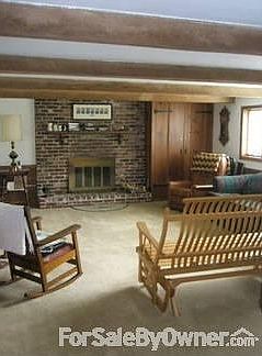 Family Room
						:
						Spacious and bright room with brick fireplace and adjacent game room.