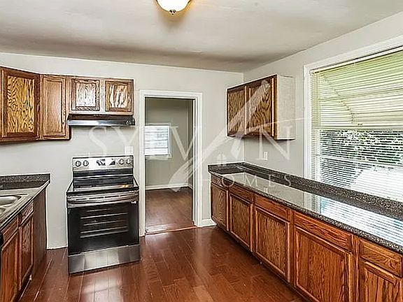 This Bar runs the entire room. Doubles as a standup desk. Zoom'd from there. Tons of cabinets.