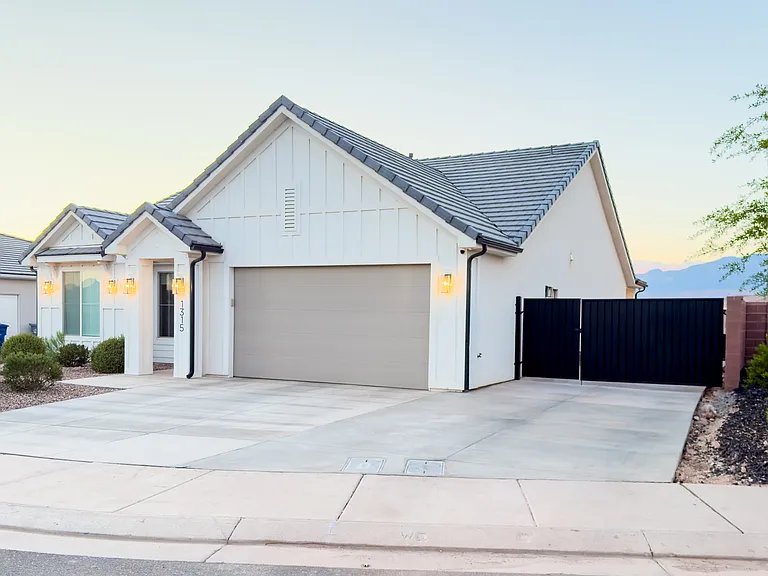 Front of home, extra driveway parking and gated parking