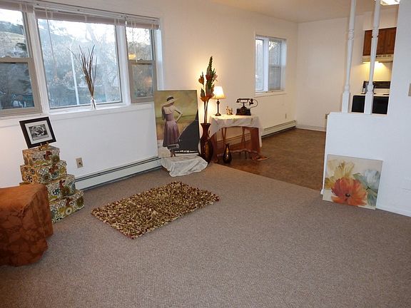 The two bedrooms are to the left of the living room.