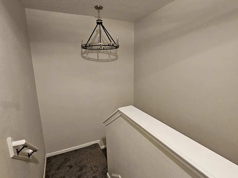 Stair case landing with drop light