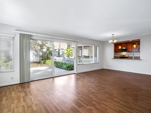 Spacious open great room, dining area looks out to garden.