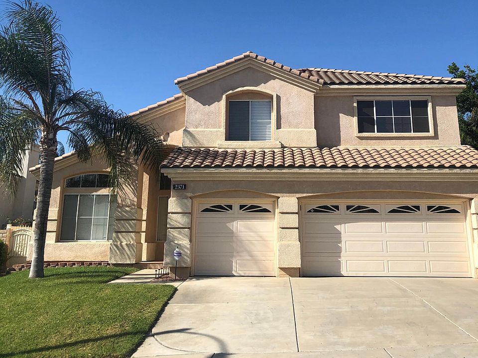 Outside of our beautiful home, professional gardener included in rent. Three car garage.