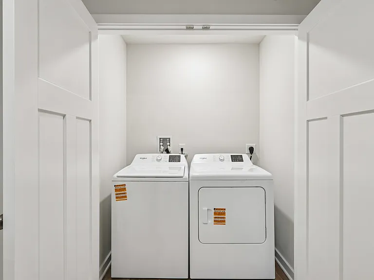 Second floor Hallway Laundry closet - New washer and dryer and space for shelving