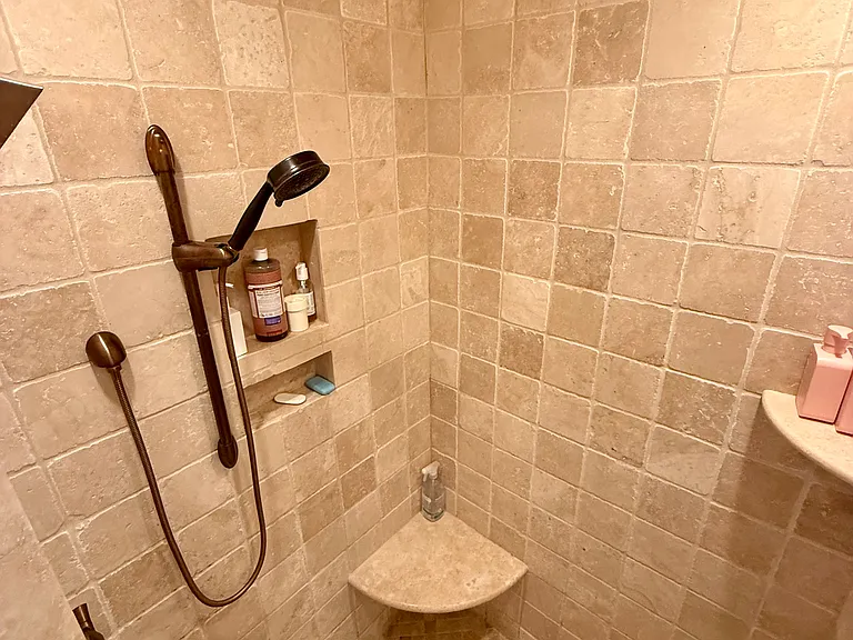 Large 6 head steam/rain walk-in shower in master bathroom.