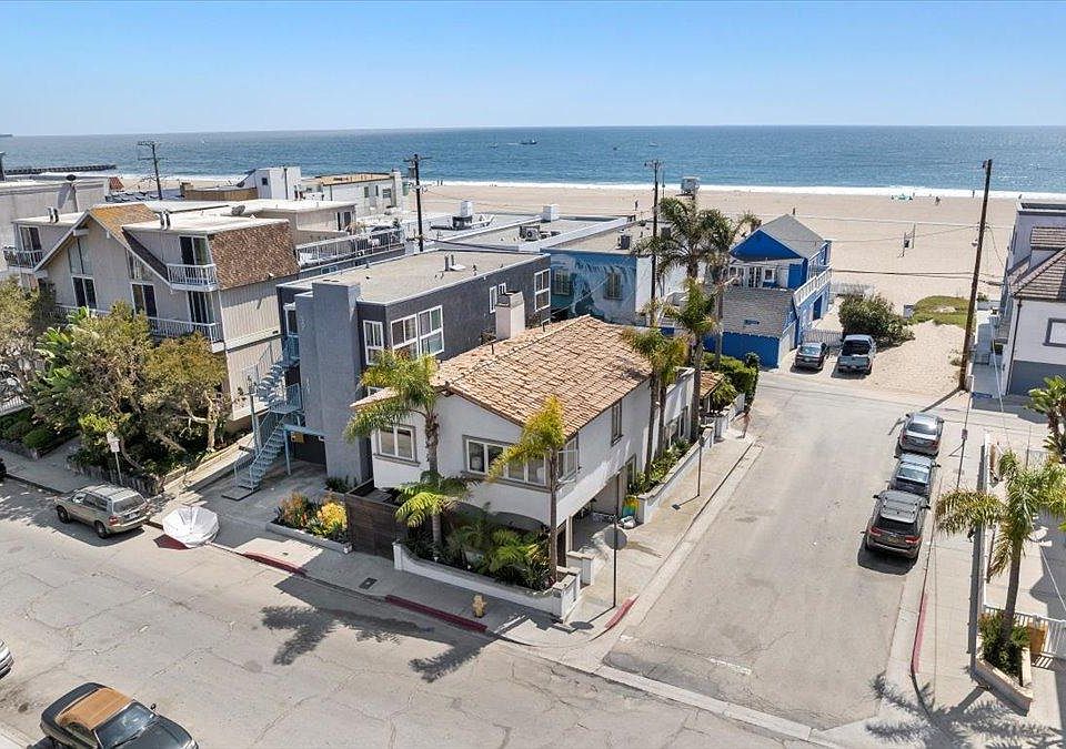 One house back from the sand with ocean views and direct beach access