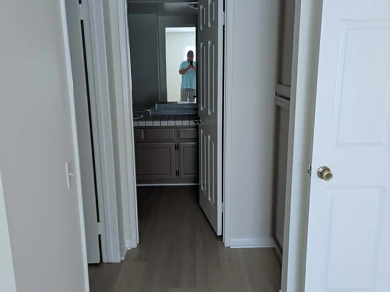 Primary bedroom with closet to the left, linen closet to the right
