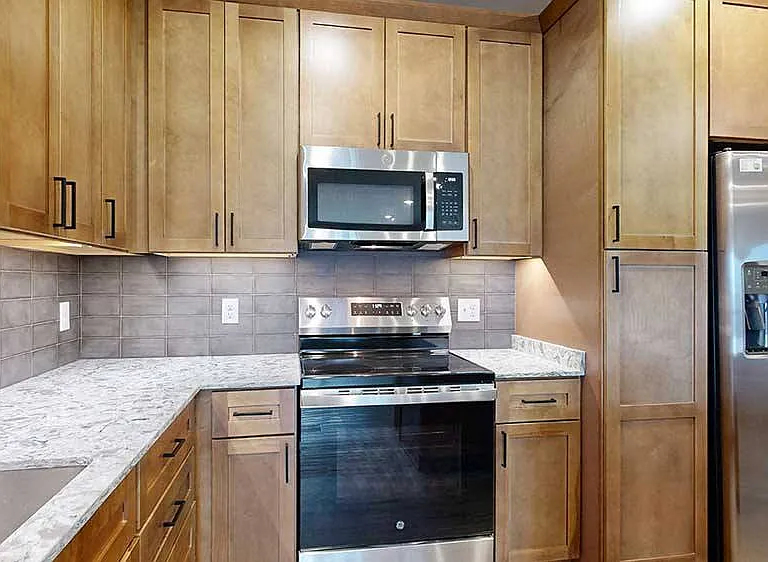 Sleek appliances and plenty of cabinet storage adorn our kitchens.