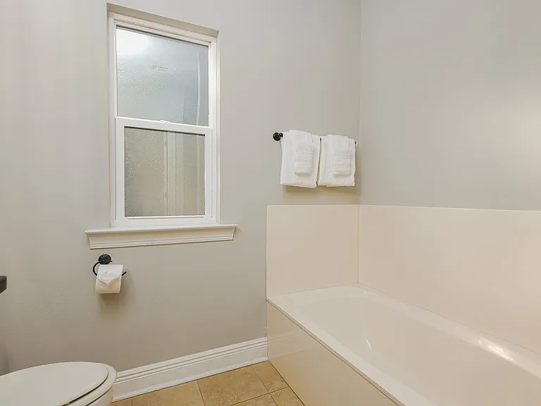 first floor bathroom with tube and shower