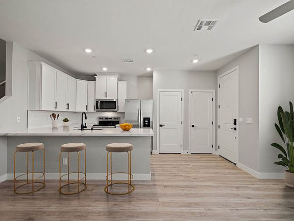 The kitchen has a breakfast bar perfect for a quick meal.