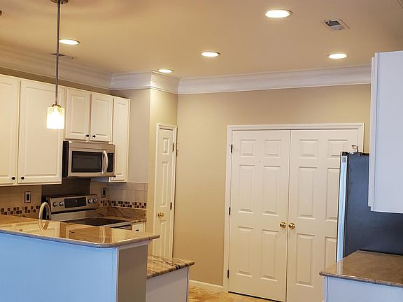 View of Kitchen. New Microwave and New Refrigerator!