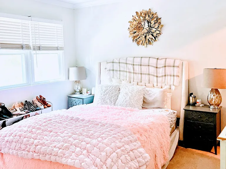 Bedroom with large closet. Note- Light Fixture and Carpet upgraded and different than photo