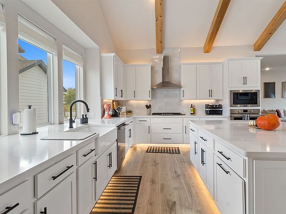Kitchen - Farmhouse sink, touch-activated faucet, Sonos speakers