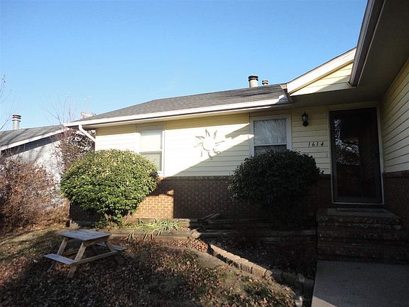 Close up of front door area. You enter into a small foyer then you go through the main door to the open living room/dining room space.