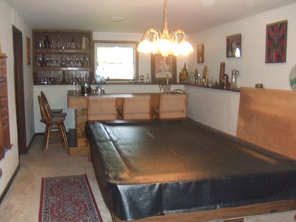 rec room with bar and pool table